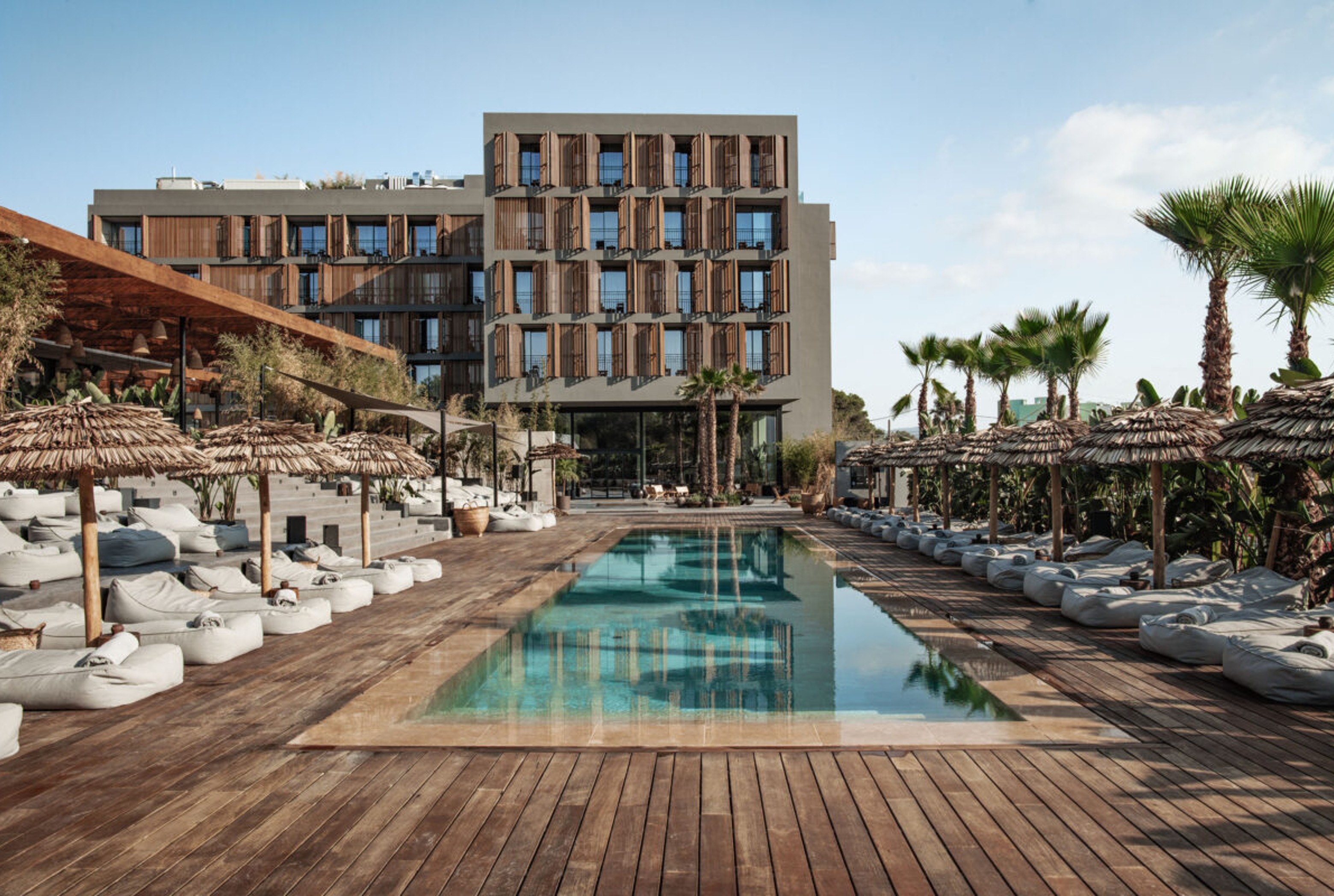 OKU Hotels — poolside at the resort